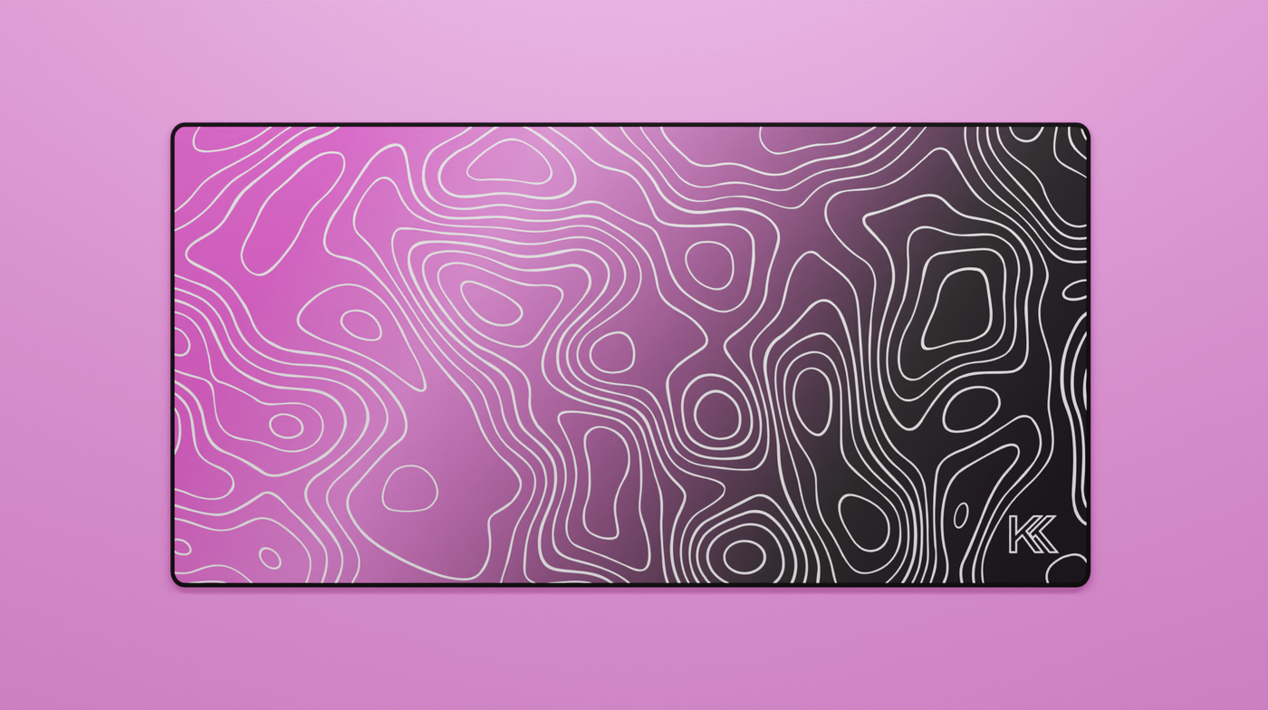 Full view of the Blink Topography Deskmat featuring a smooth pink-to-black gradient with detailed white contour lines and clean black stitched edges.