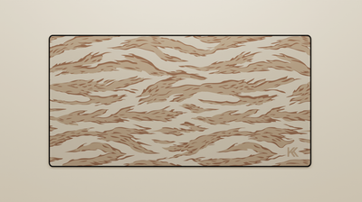 Full view of the Desert Tiger Camo Deskmat showing sandy beige and dark brown tiger stripe camouflage with hemmed edges.
