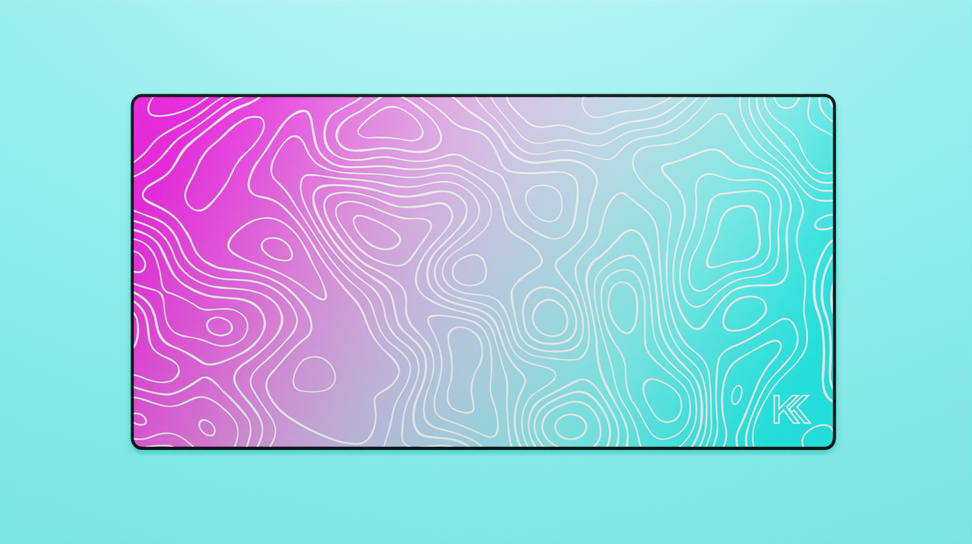 Full view of the Miami Topography Deskmat featuring a vivid pink-to-teal gradient with white contour lines and black stitched edges.