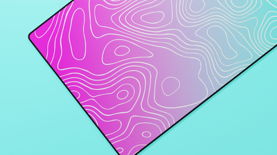 Close-up of the left side of the Miami Topography Deskmat highlighting the bold pink tones, white topographic lines, and stitched edge finish.