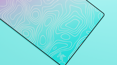 Close-up of the right side of the Miami Topography Deskmat showcasing teal hues, smooth neoprene texture, and precise hemmed stitching.