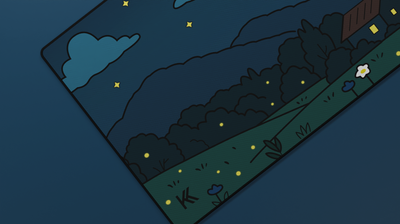 Close-up of the Midnight Meadow Deskmat showing stars, trees, and glowing fireflies against soft blue mountain tones.