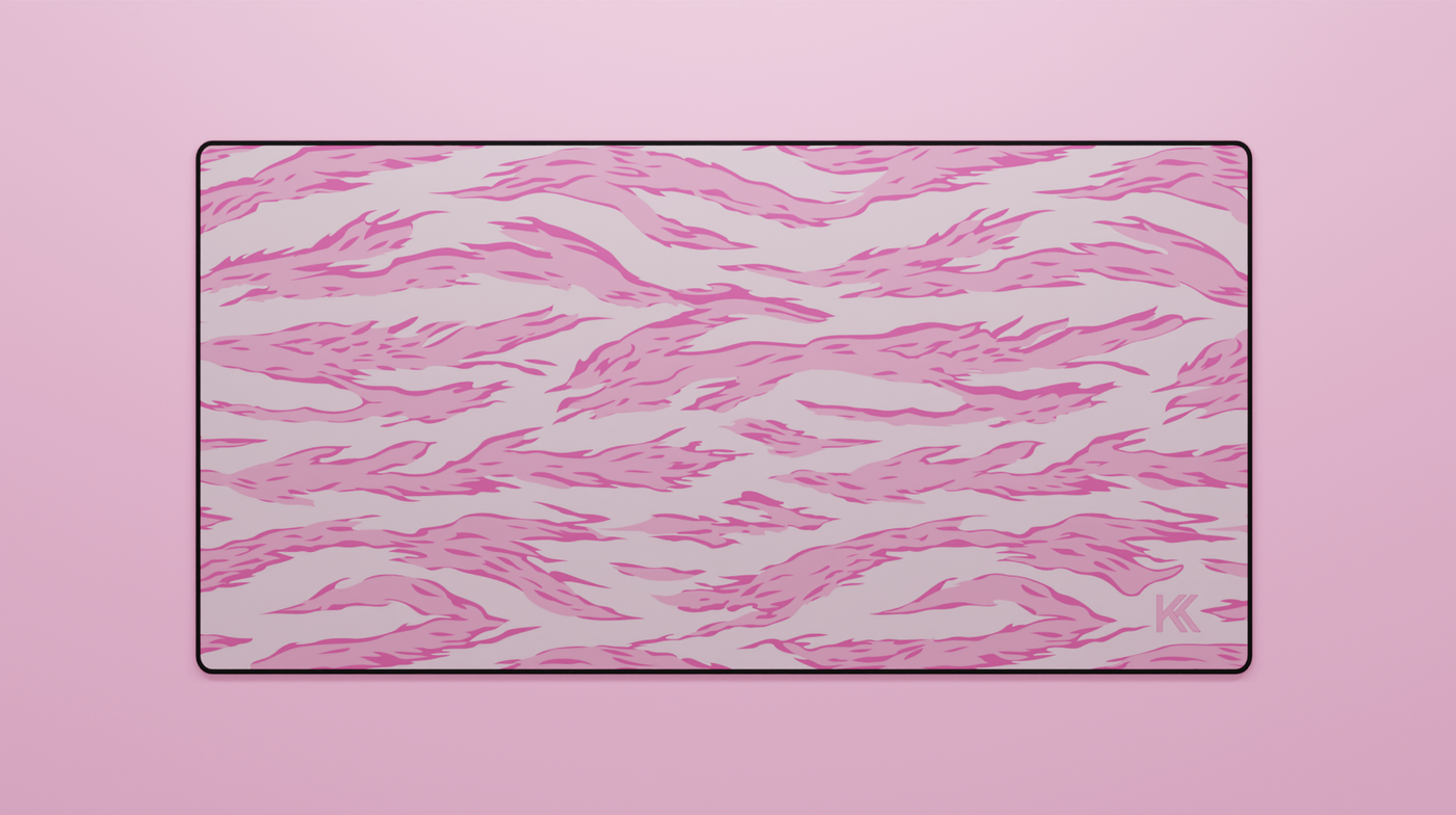 Full view of the Pink Tiger Camo Deskmat showing pink and black tiger stripe camouflage with hemmed edges.