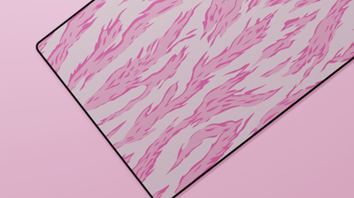 Close-up of the left side of the Pink Tiger Camo Deskmat highlighting vibrant pink tiger stripes and smooth neoprene texture.