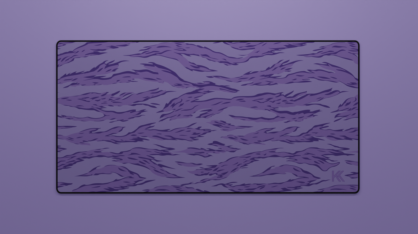 Full view of the Purple Tiger Camo Deskmat showing purple and black tiger stripe camouflage with hemmed edges.