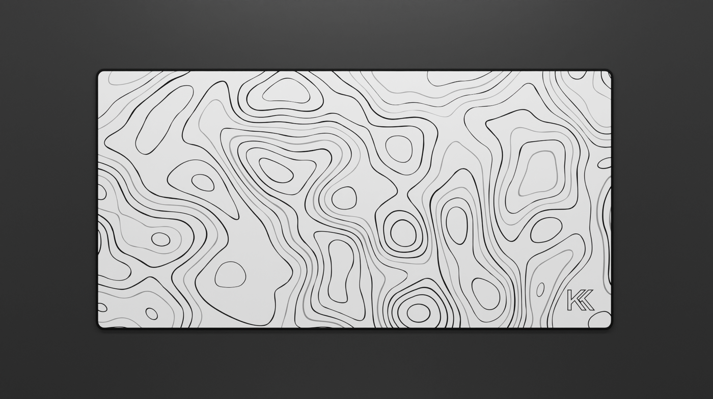 Full view of the Quartz Topography Deskmat featuring an elegant white base with subtle topographic contour lines and clean hemmed black edges.