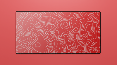 Full view of the Ruby Topography Deskmat featuring a red gradient design with white contour lines and black stitched edges.
