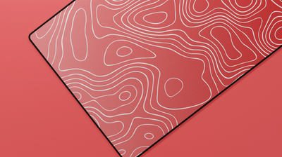 Close-up of the left side of the Ruby Topography Deskmat showing rich red tones and detailed contour lines.