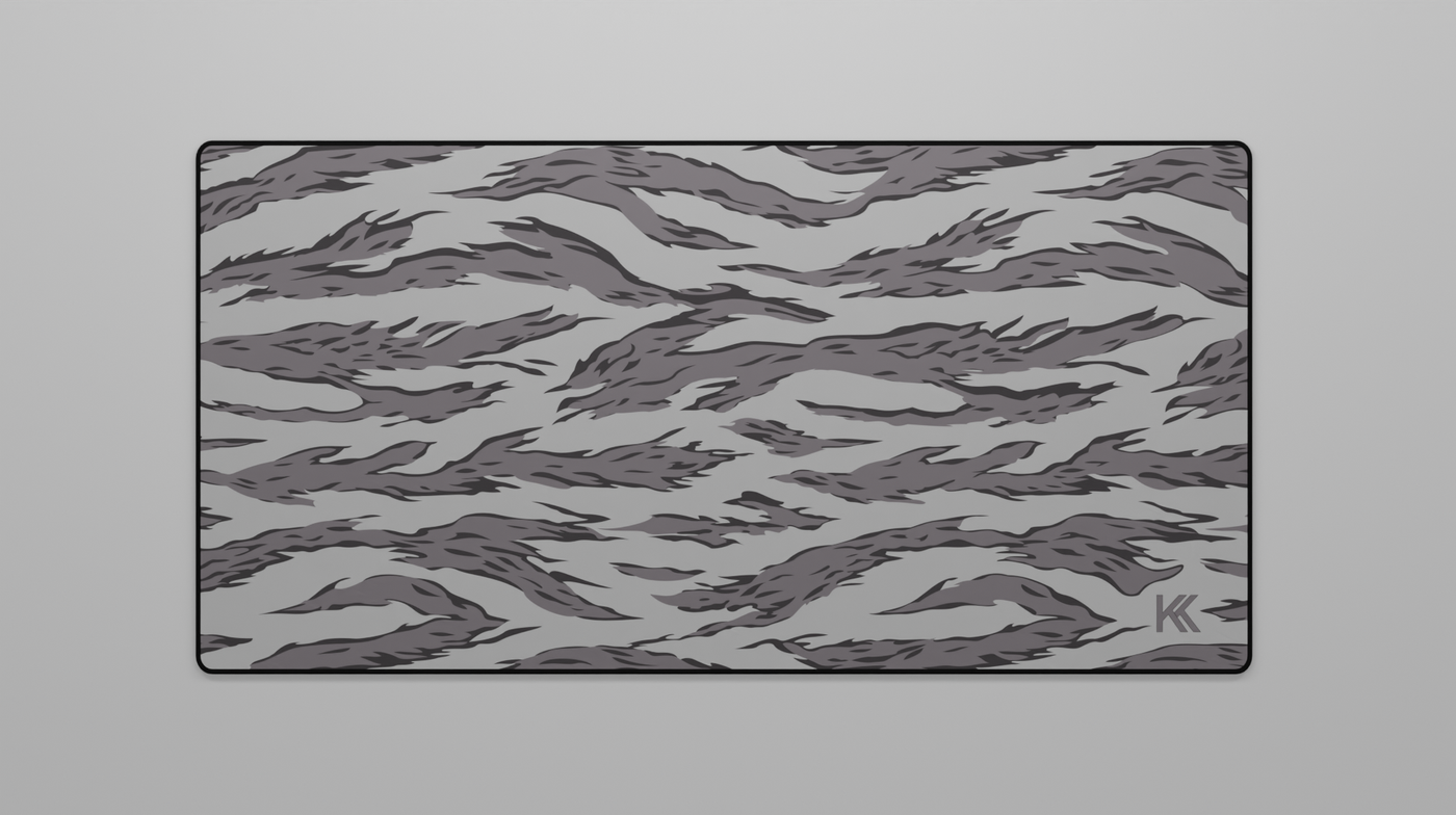 Full view of the Winter Tiger Camo Deskmat showing varying grey tiger stripe camouflage with hemmed edges.